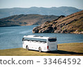white tourist bus goes to the lake 33464592