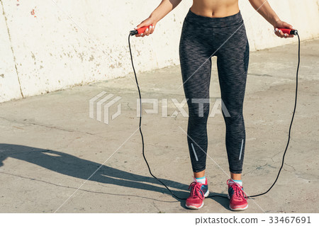 Cropped image of sports girl in sweat pants Cropped image of sports girl in sweat pants 33467691