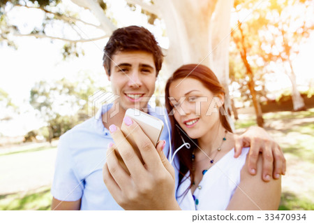 Young couple in the park Young couple in the park 33470934