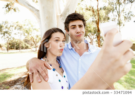 Young couple in the park Young couple in the park 33471094