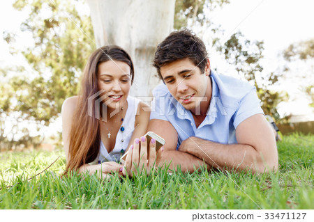 Young couple in the park Young couple in the park 33471127