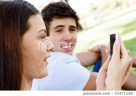 Young couple in the park Young couple in the park 33471194