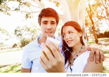 Young couple in the park Young couple in the park 33471195