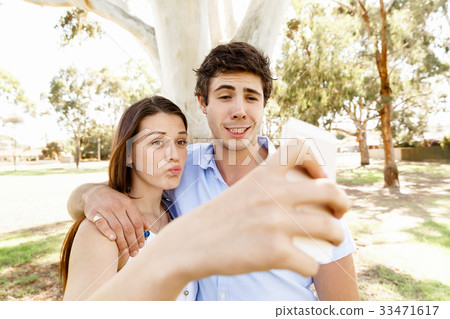Young couple in the park Young couple in the park 33471617