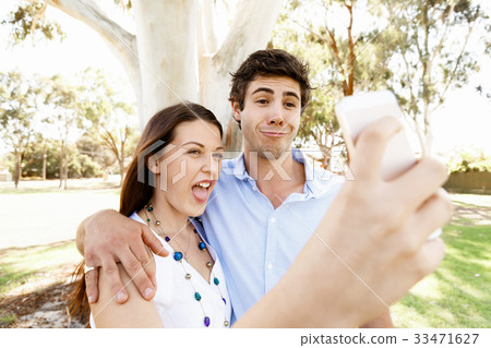 Young couple in the park Young couple in the park 33471627