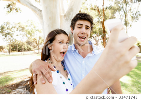 Young couple in the park Young couple in the park 33471743