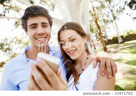 Young couple in the park Young couple in the park 33471783