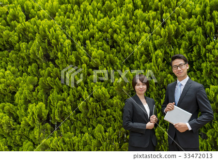 Green back businessman and business woman Green back businessman and business woman 33472013