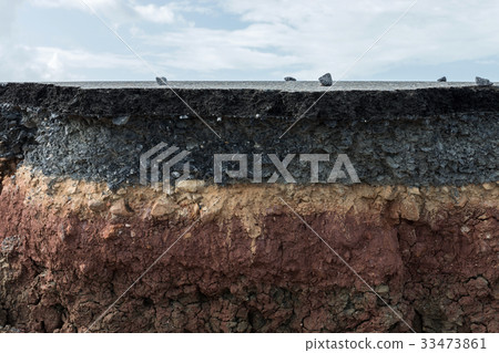 The layer of asphalt with soil and rock. The layer of asphalt with soil and rock. 33473861