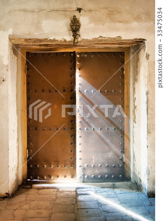 The church door almost close with light rays  33475034