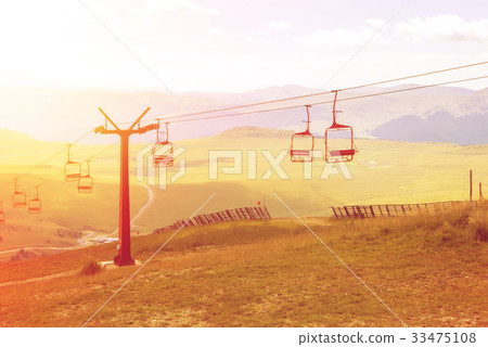 A view to red open cableway cabin over the top A view to red open cableway cabin over the top 33475108