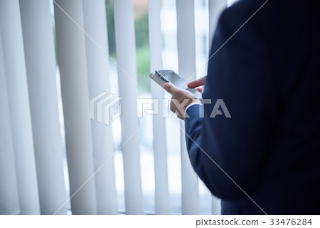 Businessman smartphone 33476284