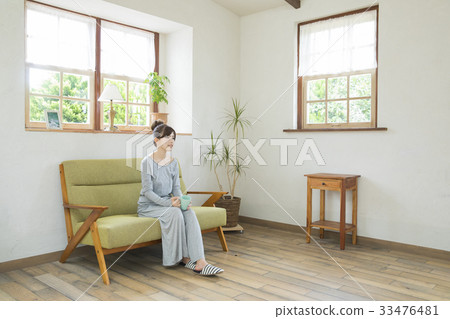 A woman drinking coffee A woman drinking coffee 33476481