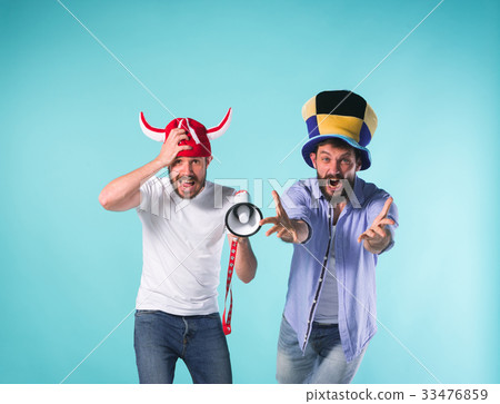 The two football fans over blue 33476859