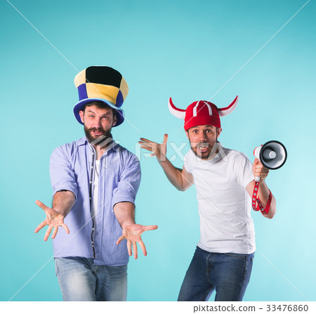 The two football fans over blue The two football fans over blue 33476860