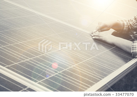 electrician working on checking solar structure 33477070