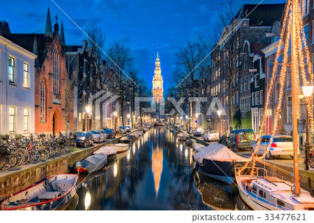 The canal in Amsterdam with Zuiderkerk church The canal in Amsterdam with Zuiderkerk church 33477621