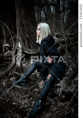 Shot of a gothic woman in a forest. 33481685