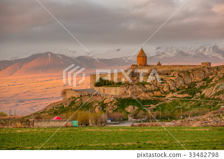 Ancient monastery in front of mountain 33482798