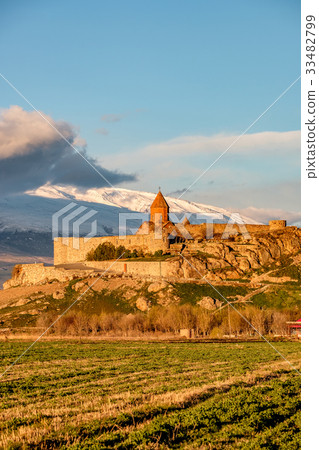 Ancient monastery in front of mountain 33482799