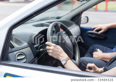 Senior learning to drive a car  33484328