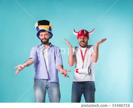 The two football fans over blue 33486728