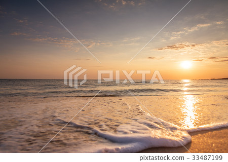 Beautiful tropical sunrise on the beach Beautiful tropical sunrise on the beach 33487199