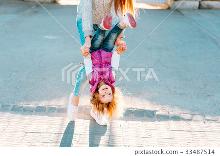 Mom and girl playing, having fun 33487514