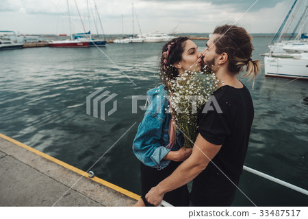 Guy and girl on pier 33487517