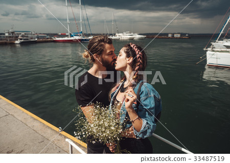 Guy and girl on pier 33487519