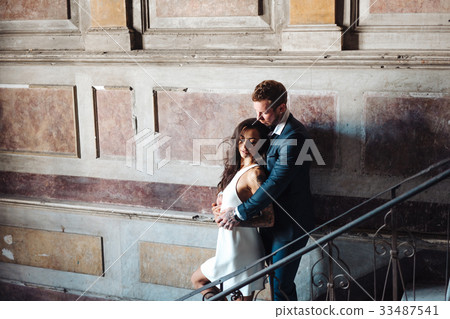 Beautiful, young couple posing on camera indoors 33487541