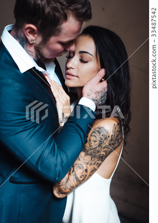 Beautiful, young couple posing on camera indoors 33487542