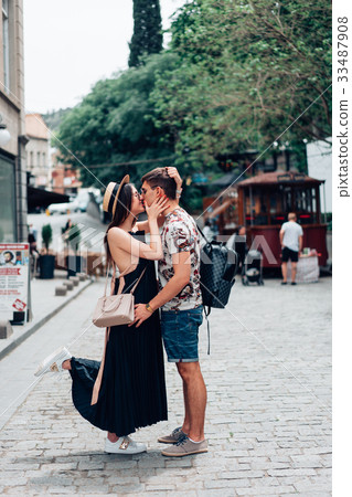 Young couple in love, hugging on the street. 33487908