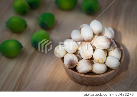 close up lotus seed on small wooden cup 33488276