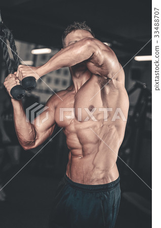 Caucasian sexy fitness model in gym close up abs. Caucasian sexy fitness model in gym close up abs. 33488707