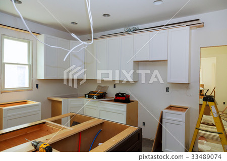 Installation of kitchen. the drawer in cabinet. 33489074
