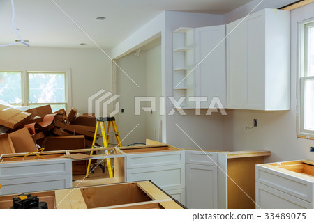 Custom kitchen cabinets in various stages  33489075
