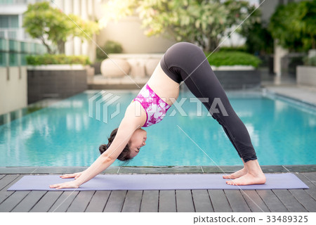 Young Asian woman doing yoga exercise 33489325