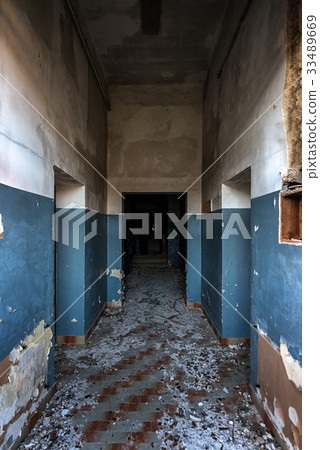 Damaged building interior with large doorway 33489669