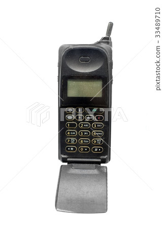 Old phone against white isolated background 33489710