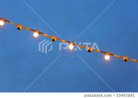Light bulbs hanging from the roof to the tree. Light bulbs hanging from the roof to the tree. 33493891