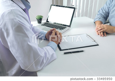 Close up of doctor filling up an history form  33495950