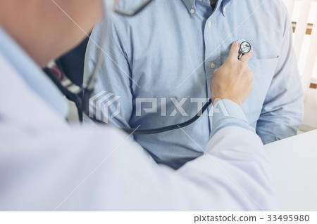 Close up of doctor listening to patient heartbeat Close up of doctor listening to patient heartbeat 33495980