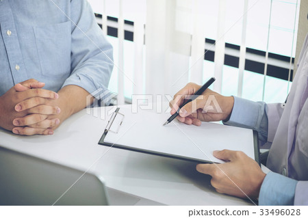 Close up of doctor filling up an history form Close up of doctor filling up an history form 33496028