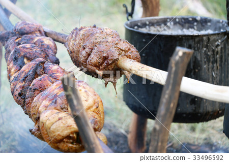 Goth meat cooking on spear Goth meat cooking on spear 33496592
