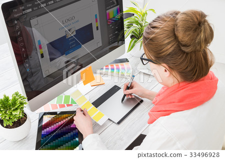 Graphic designer at work. Color samples. Graphic designer at work. Color samples. 33496928