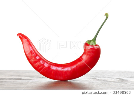 Red chili pepper on wooden plank Red chili pepper on wooden plank 33498563