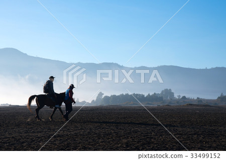 A tourist man riding a Horse at Mt.Bromo volcano. 33499152