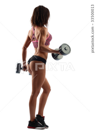 Attractive fitness woman with dumbbells Attractive fitness woman with dumbbells 33500013