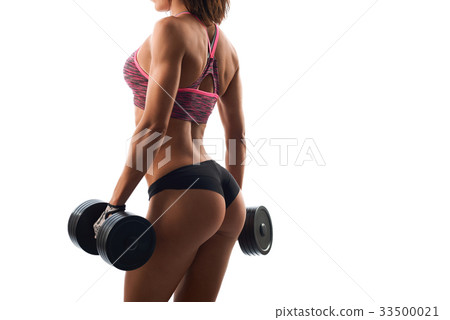 Attractive fitness woman with dumbbells Attractive fitness woman with dumbbells 33500021
